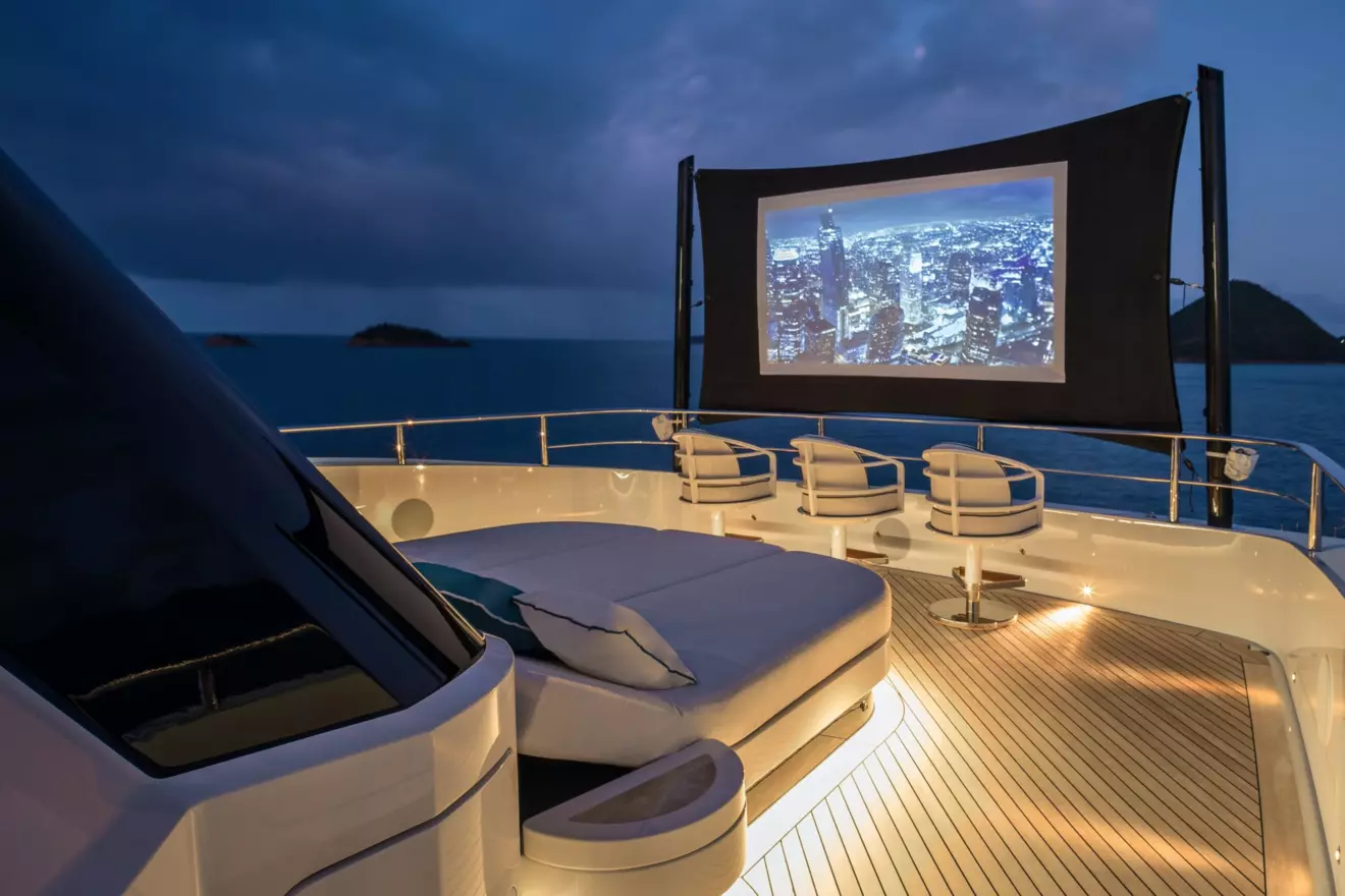 Versatile sun deck on CRN Amor &agrave; Vida featuring an outdoor cinema screen for night-time movie screenings at sea