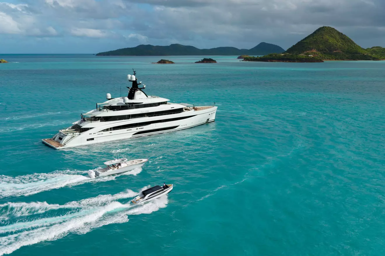 M/Y Amor &agrave; Vida 67.55m superyacht cruising with chase boat and tenders at sea