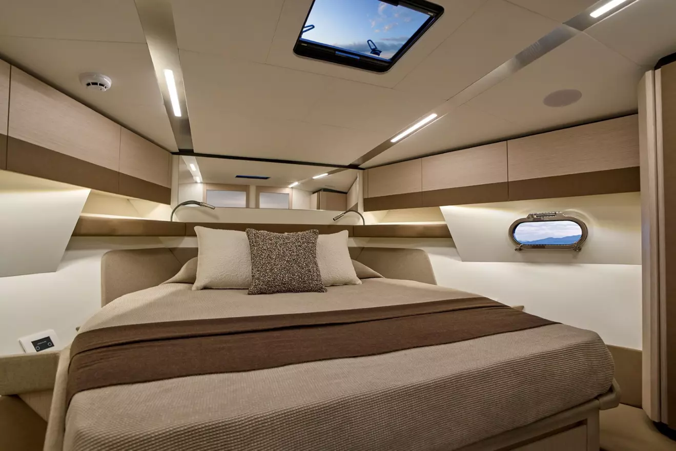 Itama 54 bow master cabin with large windows, natural light and premium upholstery